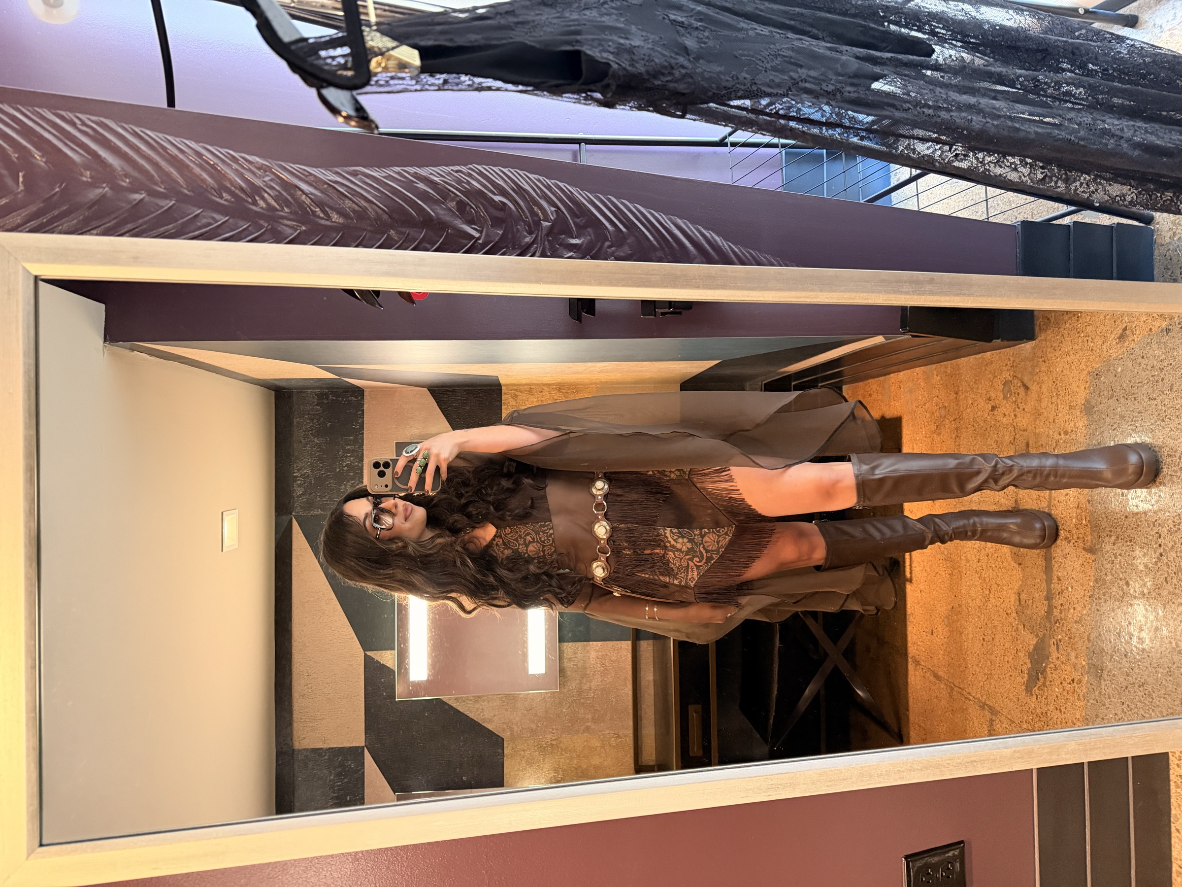 Shantaia photographing her brown embellished look backstage